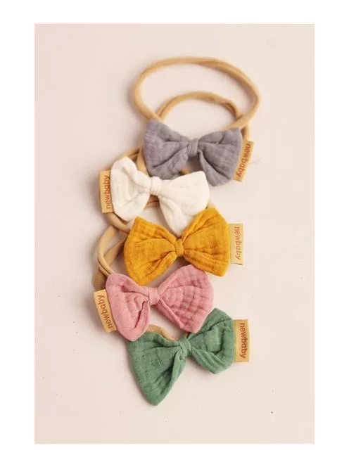 Puha muszlinból készült fejpánt csecsemőknek New Baby mustard